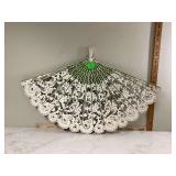 Large wall fan in green and cream colors