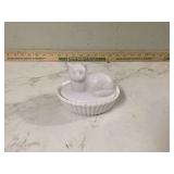 Cat on bed with milk glass