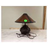 Art Nouveau-inspired lamp with amber shade and dragonfly design base