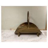 Antique brass log holder with claw feet