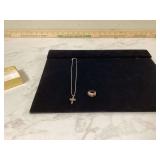 Set includes ring necklace and cross pendant