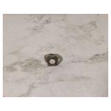 Silver ring with white gemstone