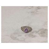 Silver ring with purple gem
