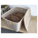 Container with beryl wood pieces