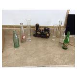 Vintage collectibles including decanter bottles vases