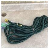 Flexible hose with sprayer