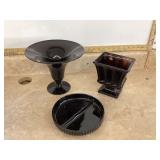 Various black and purple glass items