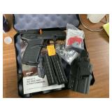 Small 22LR pistol with 2 clips and holster in case