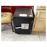 Portable safe with wheels and combination lock