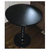 Round single pedestal table, black color. 18"