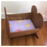 Wooden doll cradle,