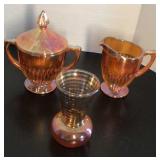 Carnival glass sugar: 5.5", creamer; 3.5", and