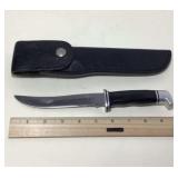 Buck knife in sheath, over all knife measures