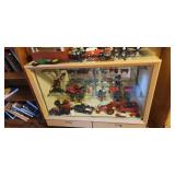 Cabinet with miscellaneous antique and collectible tractors