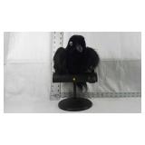 Talking toy bird on a stand