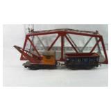 Tin Train Bridge with two Tin toys inside train