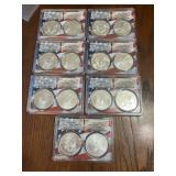 Several graded silver eagles 