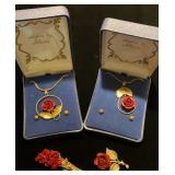 Metal rose necklaces and pins