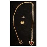 10K pendant with garnet, 14K tie tack