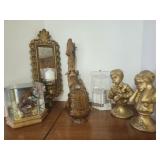 Mirror, statues, candle, decorations