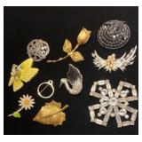 Rhinestone and gold tone brooches