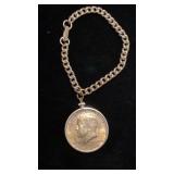 Charm bracelet with Silver Kennedy half dollar