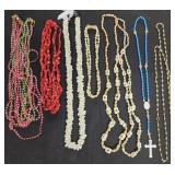 Necklaces, shells, beads, cloth