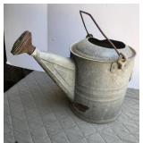 Galvanized water can