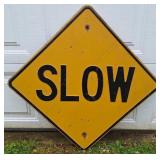 "SLOW" Road Sign