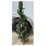 Primitive Skinny Tree with Ornaments and Lights