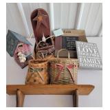 shelf with baskets, candle box and pictures