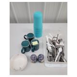 silverware,  cups, bowl is Pfaltzgraff