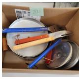 Kitchen utensils and pan and lids
