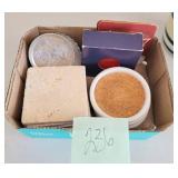 box of coasters some with logos