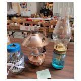 2 oil lamps  and one candle holder