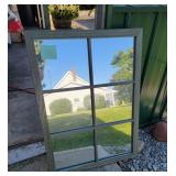 green wood framed mirror