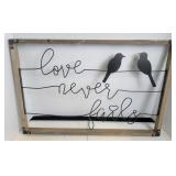 Birds On A Wire "Love Never Fails" Sign