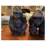 2 very heavy black ape sculptures