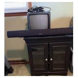 Tv stand w/doors, tv and sound bar