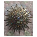 Multi-colored rhinestone sunburst brooch