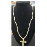 Pearl look and gold tone necklaces.