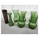 Green glass vases, one amber glass