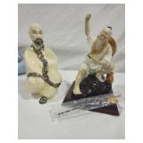 Oriental figurines, one with fishing pole
