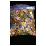 Quart bag full of pairs of vintage clip on