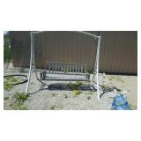 Wooden swing with frame. 81 in wide by 70 in tall