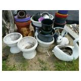 Several plastic flower pots