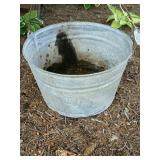 Primitive metal bucket: has holes drilled in
