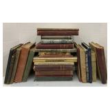 Lot of books. Spelling book, fourth reader, the