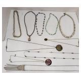 Costume jewelry necklaces ranging in length from