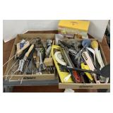 Assorted kitchen utensils and apple peeler